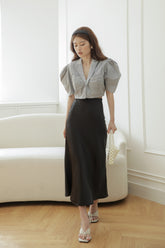 Tailored silk blouse with puffed sleeves and notched collar for elegant structured styling